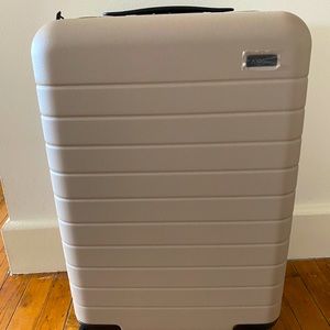 AWAY bigger carry on luggage with battery